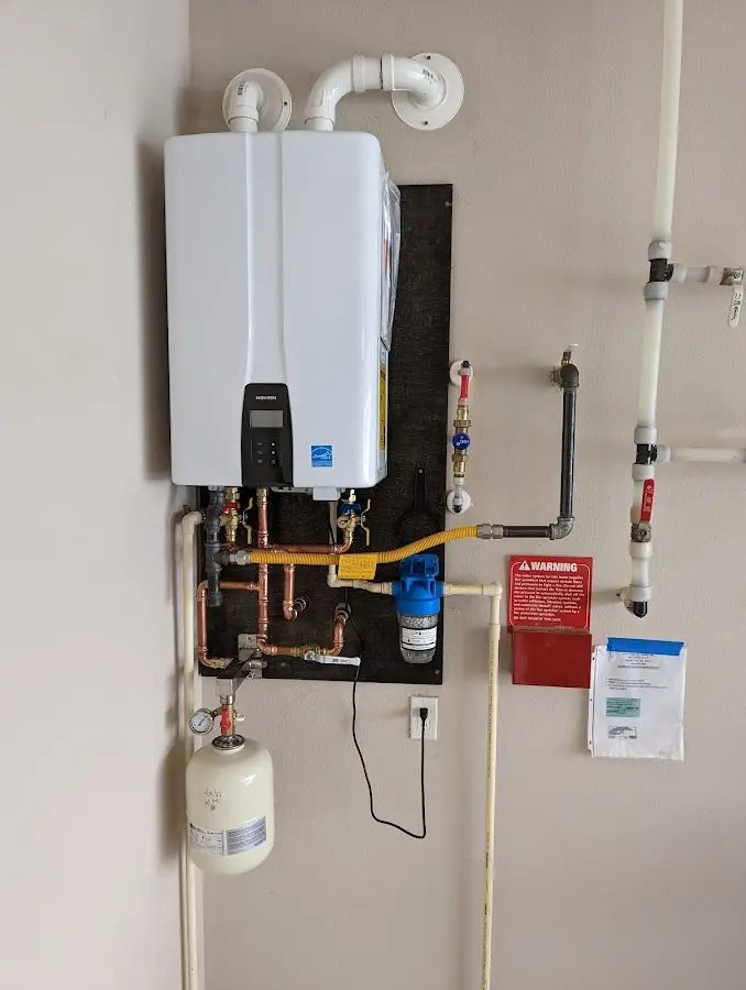 Professional plumber installing copper piping in a Southampton home